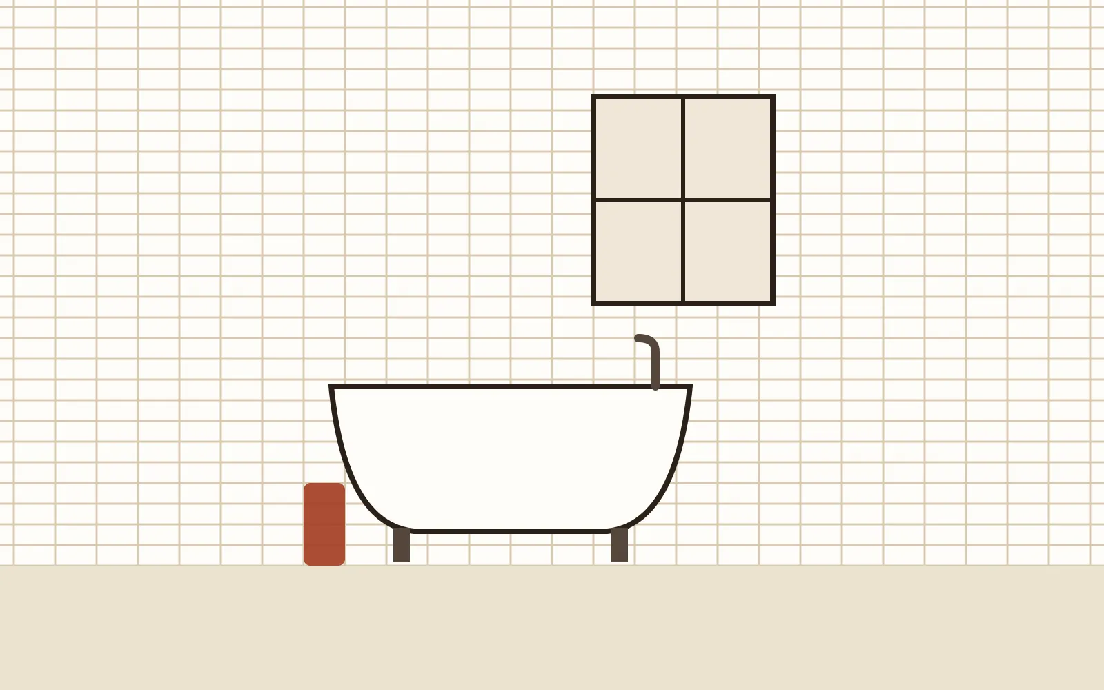 Freestanding bath against a tiled wall in a bright bathroom